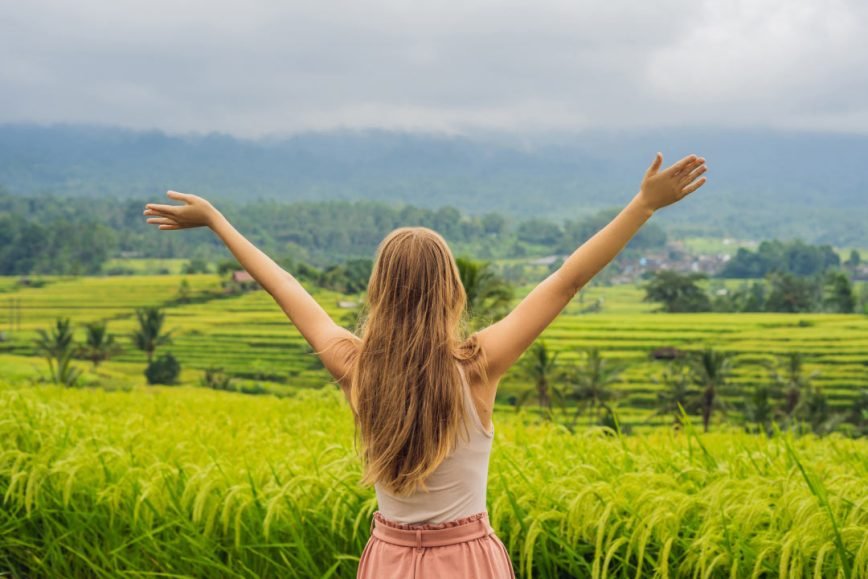 Traveler overlooking terraced rice fields in Bali